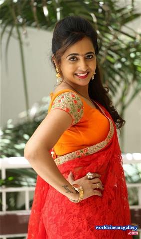 Anchor Lasya Latest Stills in Orange Saree