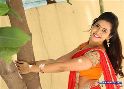 Anchor Lasya Latest Stills in Orange Saree