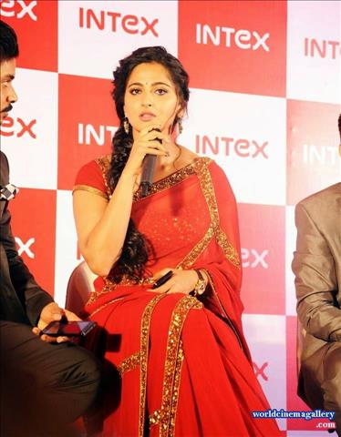  Anushka in Red Saree Stills at INTEX Aqua Smartphone Launch