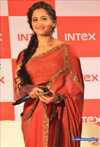  Anushka in Red Saree Stills at INTEX Aqua Smartphone Launch