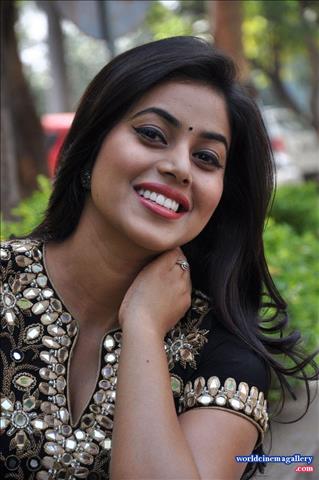Poorna Cute Stills at RGG Success meet in black  dress