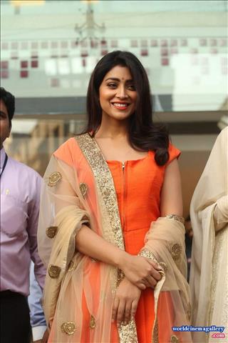 Shriya Saran Stills at label bazaar curtain Raiser Event in Orange Dress  