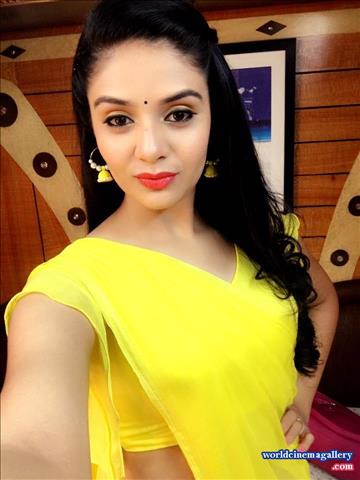 Sreemukhi Cute in Yellow Saree 