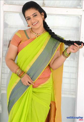 Telugu Tv Actress Sujitha stills in Yellow Saree 