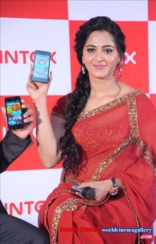 Anushka Stills in Red Transparent Saree at Intex Mobile Launch