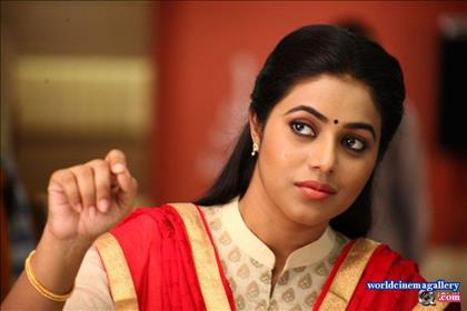 Poorna Stills in Red Saree