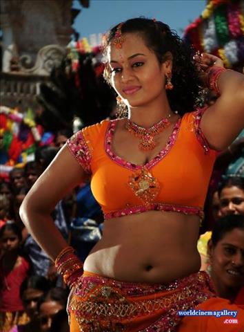 Suja Varunee Hot Stills in Orange Dress