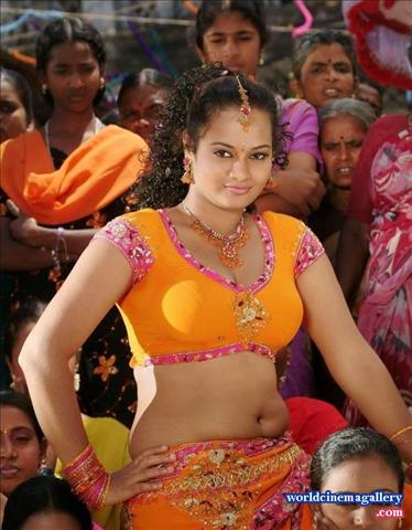 Suja Varunee Hot Stills in Orange Dress